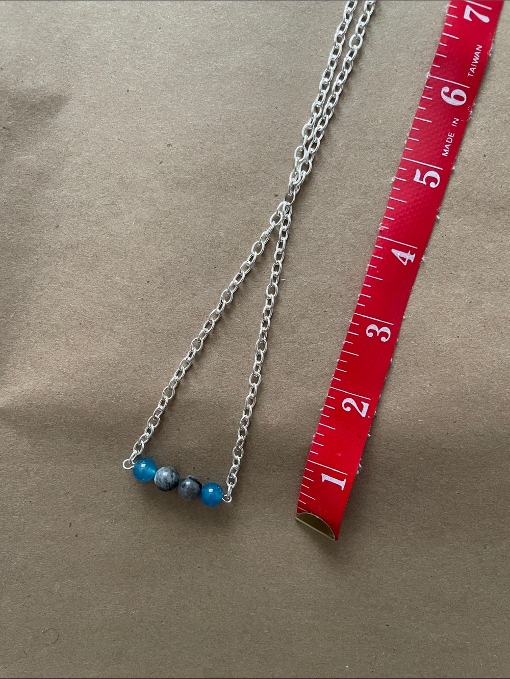 V Shaped chain necklace with gemstones.